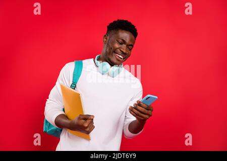 Photo of millennial hipster guy use gadget search discounts wear long sleeve shirt isolated vibrant color background Stock Photo