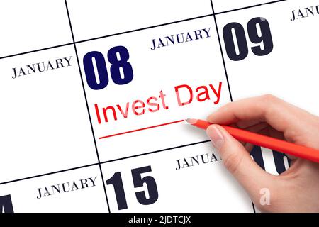 8th day of January. Hand drawing red line and writing the text Invest Day on calendar date January 8. Business and financial concept. Winter month, da Stock Photo