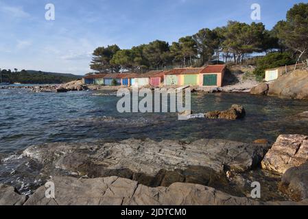 Colourful Old Boatsheds on the Shore near the Beach or Plage de Bregançon opposite Bregançon Fort & Island Bormes-les-Mimosas Var Provence france Stock Photo