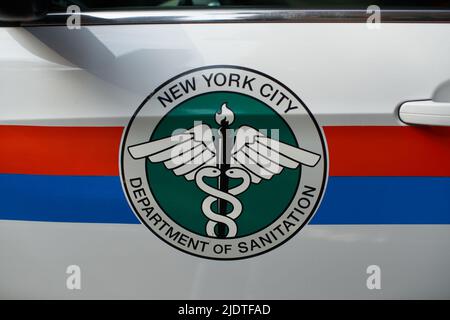 Manhattan, USA - 11. November 2021: New York City Department of Sanitation badge. Icon on car of DSNY department. NY strongest keeping NYC clean Stock Photo