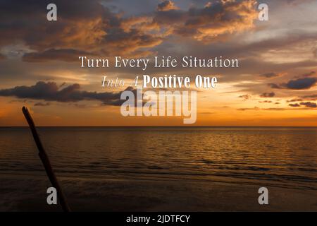Motivational and inspirational quote on sunset beach - Turn every life situation into a positive one. Stock Photo