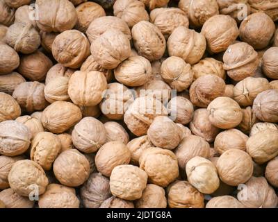 Heap of Whole Walnuts dry fruit also called akhrot in India. Walnut is a popular dryfruit. Stock Photo