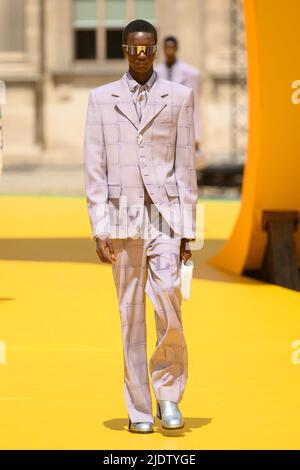 Paris, France. 23/06/2022, A model walks the runway during the Louis Vuitton  Menswear Spring