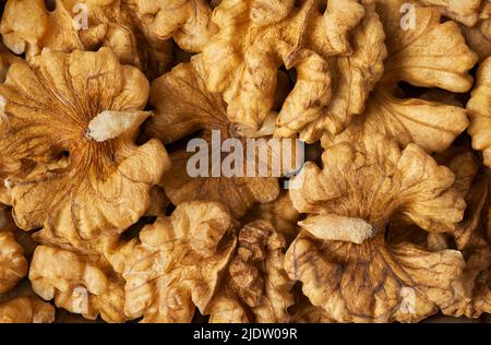 Big group of peeled walnuts, abstract food background Stock Photo