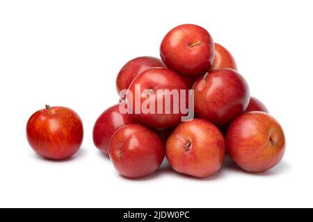 Heap of fresh sweet cherry plums isolated on white background close up Stock Photo