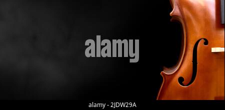 Violin on a black background close up Ancient stringed instrument. Classical music. Stock Photo