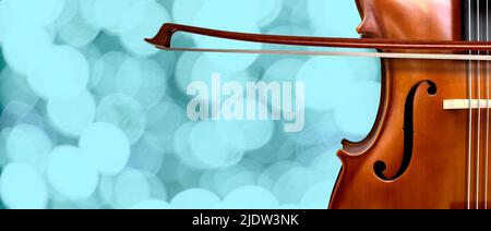 Violin on a bokeh lights background close up Ancient stringed instrument. Classical music.. Copy space Stock Photo