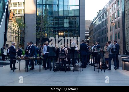 London, United Kingdom - May 12, 2022: City of London executive workers having a drink and socializing after work Stock Photo