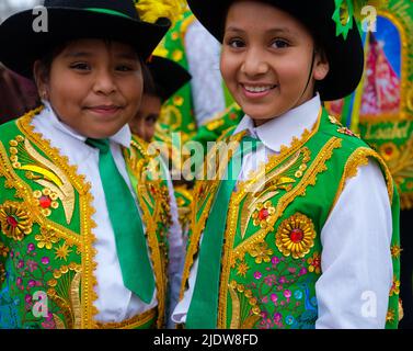 LIMA, PERU - CIRCA SEPTEMBER 2019: Portrait of Peruvian kids during a typical celebration in the Square San Martin in Lima, Peru. Stock Photo