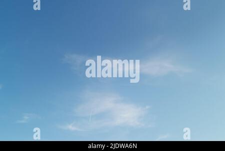 Full frame of pretty blue sky with wispy white cloud formation Stock Photo