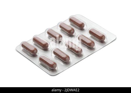 Brown capsules in aluminum blister pack isolated on white Stock Photo
