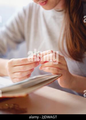 Lifestyle concept, work from home to reinvent your life - Jewelry designer workplace. Woman make jewelry. Georgian minankari enamel manufacturing tech Stock Photo