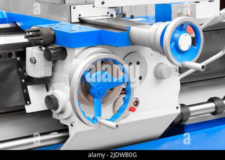 Lathe control knobs close up. Metal machine tools industry. The metalworking process by turning machine. Stock Photo