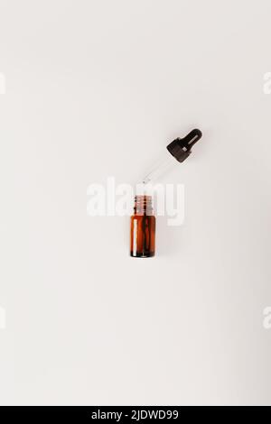 Bottles of dark amber glass. Natural cosmetic. Flat style, top view Stock Photo