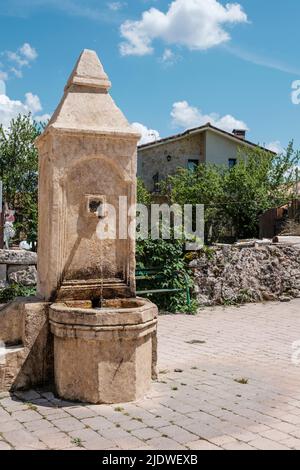 Spain, Old Fountain at San Nicolas de Bari Church, San Juan de Ortega. Stock Photo
