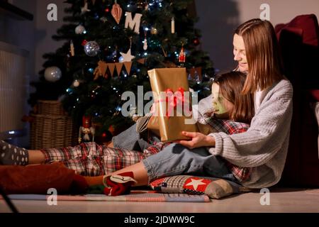 Christmas Family Open Lighting Present Gift Box Under Xmas Tree Happy  Mother Father Children Stock Photo - Download Image Now - iStock