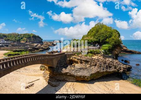 Biarrtiz, France - May 7th 2022 - tourists visiting the rocks of Rocher du Basta in Biarritz Stock Photo