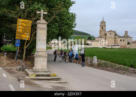 Spain. Walking toward Castrojeriz. A Sign Bearing an Arrow and Scallop Shell points the way to the Camino. Stock Photo