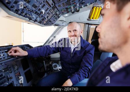 a happy man and pilot apprentice Stock Photo