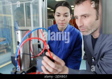 two administrators male and female at server room Stock Photo