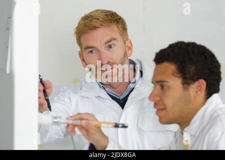 portrait of painter with apprentices Stock Photo