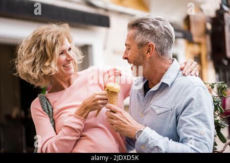 Happy mature tourists having ice cream Stock Photo