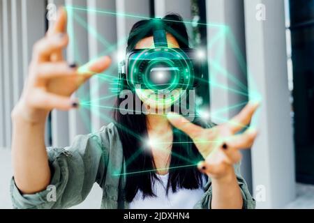 Woman wearing VR simulator using transparent interface Stock Photo