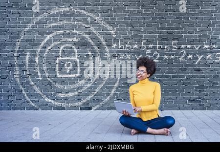 Young woman using laptop with secure internet connection Stock Photo