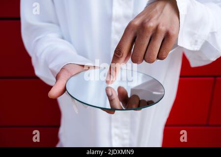 Woman pointing finger on mirror Stock Photo