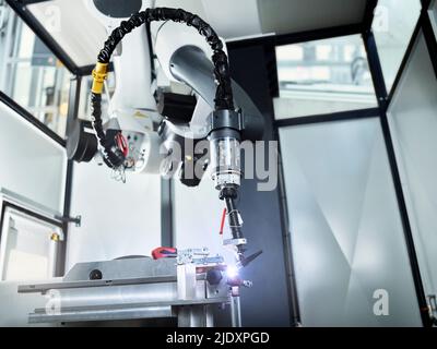 Robotic arm welding in industry Stock Photo