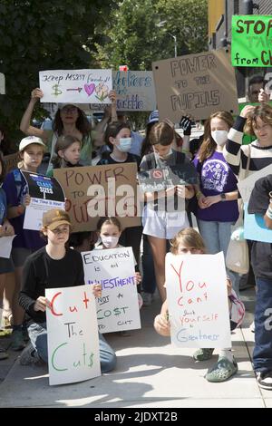 Teachers, students and parents demonstrate in front of a public school in Windsor Terrace in Brooklyn against Mayor Adams new school budget cuts after just emerging emerging from the difficult Covid-19 Pandemic. Stock Photo