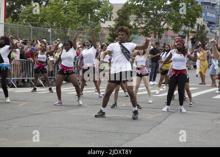 After 2 years from a Covid-19 shutdown, people return to the annual Mermaid Parade, alleged to be the largest art parade in the nation, at Coney Island along Surf Avenue in Brooklyn, New York. Dancers perform at the parade. Stock Photo