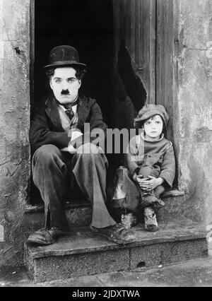 Publicity photo from Charlie Chaplin's 1921 movie 'The Kid'. Pictured are Charlie Chaplin (left) and Jackie Coogan (right). Stock Photo