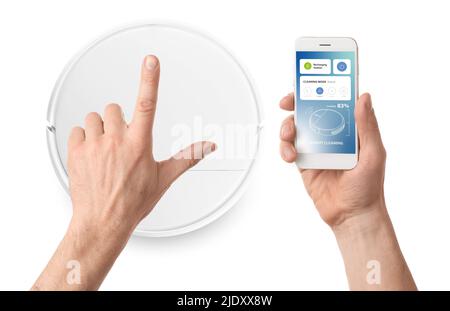 Man with mobile phone and modern remote controlled robot vacuum cleaner on white background Stock Photo