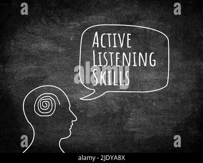 Active listening concept. Head figures on the board Stock Photo - Alamy