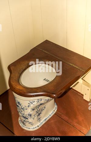 Enkhuizen, Netherlands. June 2022. A toilet made of Delft porcelain at the Zuiderzee Museum in Enkhuizen. High quality photo.