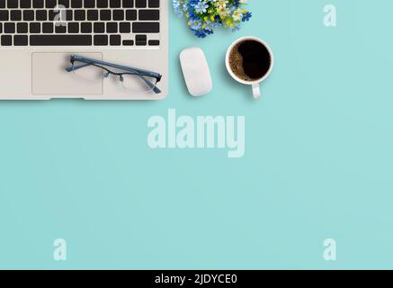 Business office desk concept ideas. top view with laptop computer and notebooks,coffee,glasses on green background. Stock Photo