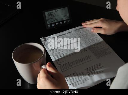 File photo dated 31/07/18 of a smart meter next to an energy bill, as households are facing a 'huge' jump in energy-related scams as fraudsters exploit fear and confusion around soaring bills, figures show. Stock Photo