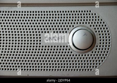 Buttons on an old gray TV close-up turn on and off, watch TV, buttons and a speaker on the TV Stock Photo