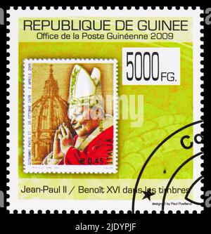 MOSCOW, RUSSIA - JUNE 17, 2022: Postage stamp printed in Guinea shows Italy, Pope John Paul II, Pope Benedict XVI serie, circa 2009 Stock Photo