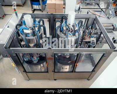 Conveyor line and filling machine in beverage production plant or factory. Stock Photo