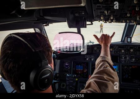 At Sea. 23rd May, 2022. Lt. j.g. Matt Paxson, left, signals to Aviation Electronics Technician 3rd Class Madison Buncher, both assigned to the 'Grey Knights' of Patrol Squadron (VP) 46, deployed with Commander, Task Force (CTF) 57, during the engine starting sequence of a P-8A Poseidon maritime patrol aircraft, May 25. CTF 57 aircraft conduct missions in support of maritime operations to ensure security and stability in the Middle East region. Credit: U.S. Navy /ZUMA Press Wire Service/ZUMAPRESS.com/Alamy Live News Stock Photo