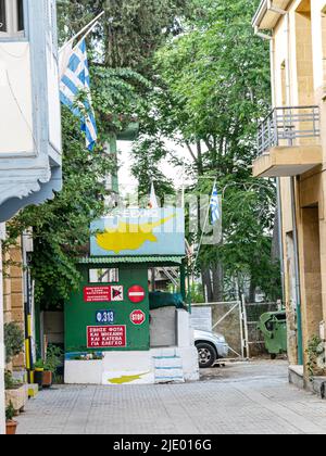 Border post bearing Greek and Greek Cypriot symbolism along the UN Buffer Zone in Nicosia, Cyprus Stock Photo