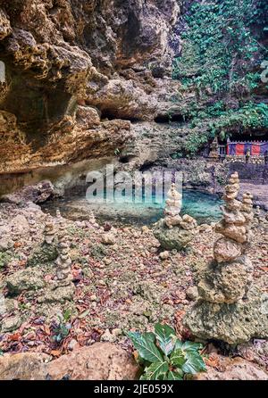Stone towers around a natural pool in Nusa Penida Island, Indonesia Stock Photo