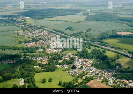 The village of Aberford, West Yorkshire, northern England, route of the old A1, adjacent to the new A1 Motorway, shot from the air Stock Photo