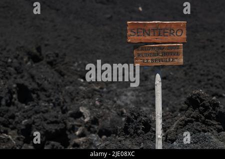 Signpost across lava field to Le Betulle hotel destroyed by eruption, 2002, Piano Provenzana Etna North, Etna volcano, Sicily, Italy Stock Photo