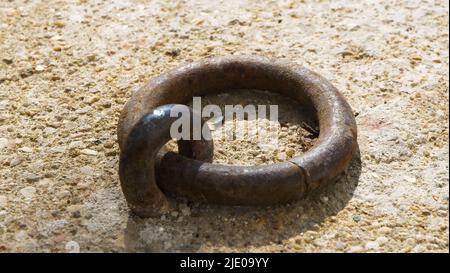 Gorgeous rusted old metal handle, vintage handle on brown stone, medieval handle, design with abstract art. grunge painting, flat color. Abstract art Stock Photo
