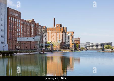 Editorial: DUISBURG, NORTH RHINE-WESTPHALIA, GERMANY, MAY 15, 2022 - Restored warehouses in the inner harbor of Duisburg, a since 1994 restored distri Stock Photo