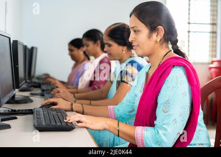 group of women busy learning or working on computer at training center - concept of empowerment, learning and education Stock Photo