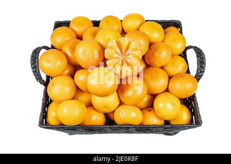 Basket of delicious tangerines and peeled wedges ready to eat and enjoy on isolated white background. Stock Photo